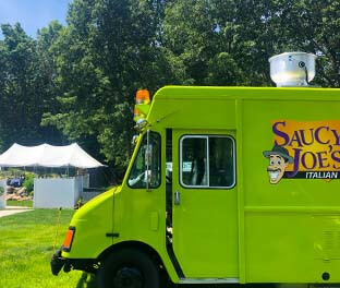 Saucy Joe's Food Truck parked in backyard at private party