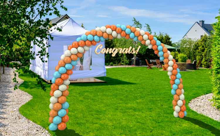 Balloon arch at backyard graduation party