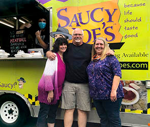 teachers in front of food truck