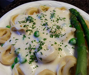 Tortellini Romano with peas and asparagus