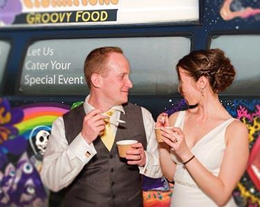 Groom with Groomsmen in front of Saucy Joe's Food Truck