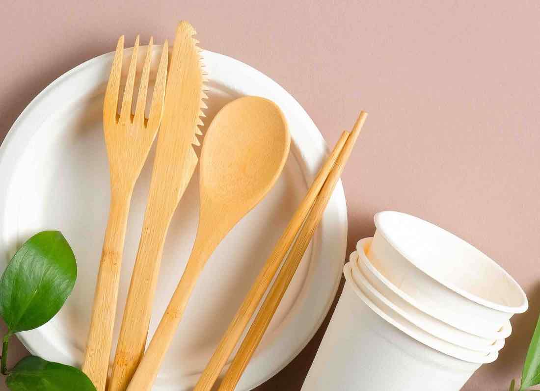 Assorted serve ware, including plate, cups and cutlery